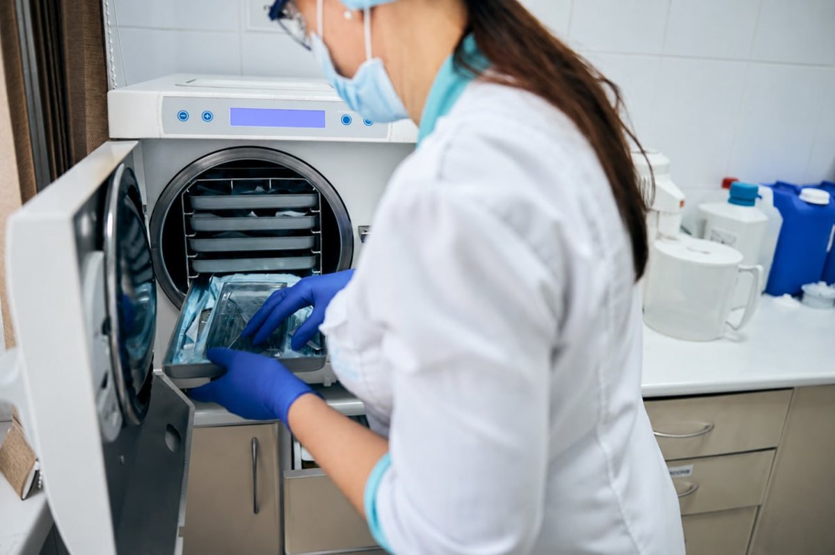 Technician inspecting and servicing equipment in a workshop