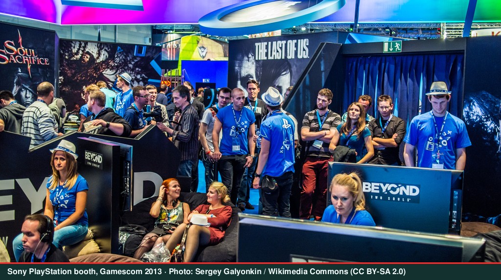 Sony PlayStation booth with illuminated displays at Gamescom 2013