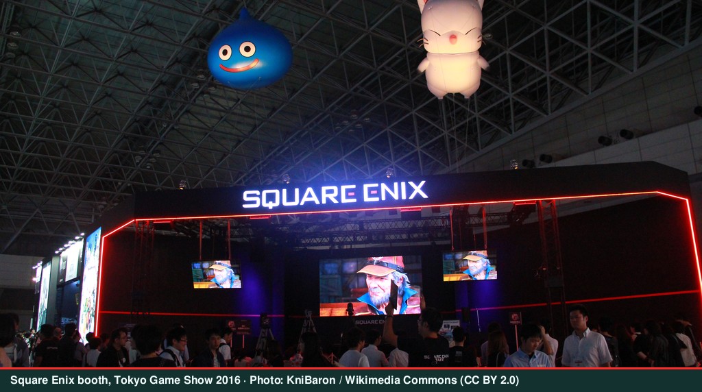 Exhibitors at a technology company booth during an AI industry conference